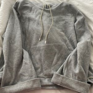 J crew size medium grey hoodie. Has a sort of cropped bottom to it.